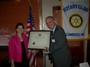 The Rotary Charter is passed from President For Life Denise Jillson to our new leader, President Marc O'Brien.
